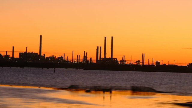 The skyline of the industrial area of ​​Porto Marghera at sunset seen from the train