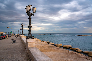 Bari seafront lights. Coastline and Twilight purple and blue sky.