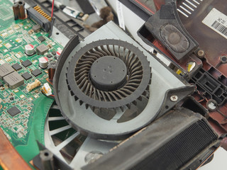 A broken laptop that fell on the concrete floor.It lies on a white background with the case open.