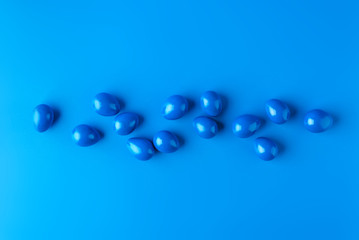Minimalistic background with blue Easter eggs