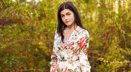 Fototapeta premium Trendy female in green garden