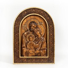 Fototapeta na wymiar Wooden icon Holy Family on an isolated background.