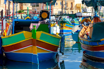 Plakat Marsaxlokk. Traditional boats Luzzu in the old harbor.