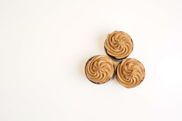 Fototapeta premium Three chocolate cupcakes