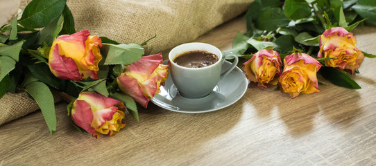 Fresh italian style coffee next to flower bouquet
