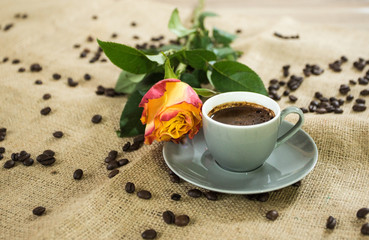 Fresh italian style coffee next to flower bouquet