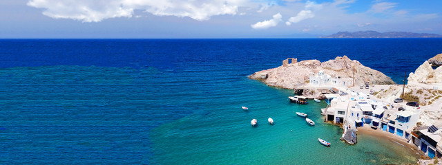Aerial drone ultra wide photo of famous fishing seaside village of Firopotamos with traditional Cycladic character, Milos island, Cyclades, Greece