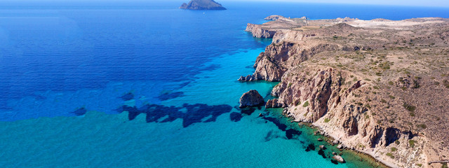 Fototapeta na wymiar Aerial drone ultra wide photo of famous rocky bay of Plathiena with turquoise beautiful sea, Milos volcanic island, Cyclades, Greece