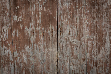 background of a brown peeling paint on a wooden surface