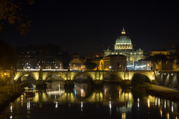 Fototapeta premium Night scene of Rome, Tevere river with basilica in background
