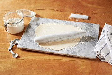 pastry dough with marble rolling pin
