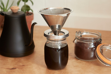 metal coffee pour over jar on kitchen counter