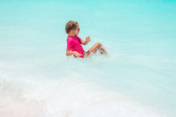 Cute little girl at beach during caribbean vacation