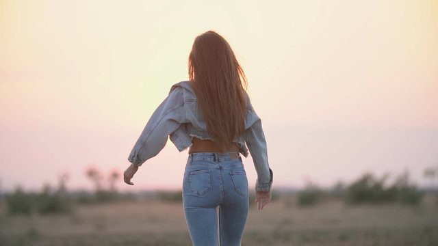 girl with long hair and jeans