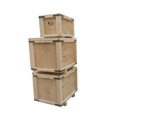 Boxes of plywood of different sizes are stacked on top of each other. Wooden industrial packaging with metal corners.
