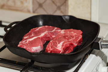 Raw beef steak in grill pan
