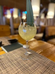 glass of white wine on table in restaurant