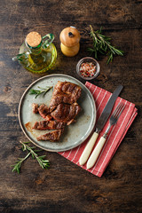 Two beef steak on dark gray background