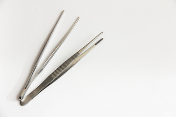 medical tweezers for surgery on a white background