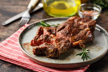 Two beef steak on dark gray background