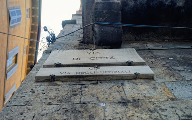 Via di Citta Street sign of wall Siena
