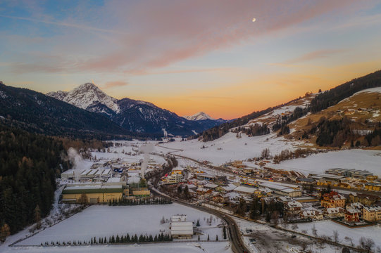 San Candido Innichen by sunrise in South Tyrol Alto Adige, Italy during winter season. Aerial drone shot in january 2020