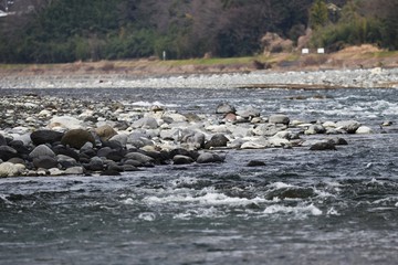Stones on the riverbed / Background material of the natural scene.