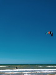 kitesurf athlete rides the waves of the Baltic Sea