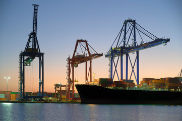 Fototapeta premium Maritime cranes in the port at night