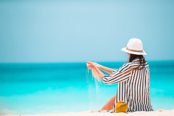 Young beautiful woman on beach vacation on Caribs