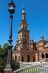 view of the North Tower at the end of the neo-Moorish style building located in the beautiful Plaza de Espana in the city of Seville in Andalusia, Spain