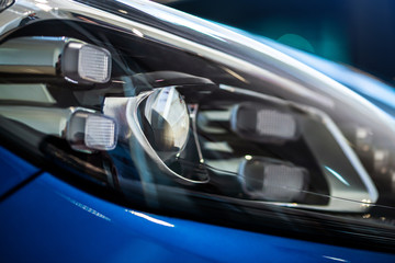 Fototapeta na wymiar extreme close up of car headlight