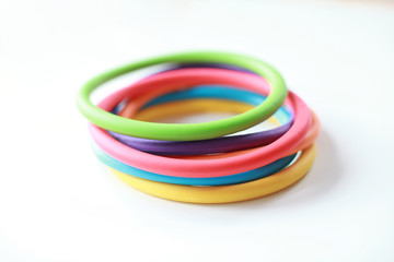 Colourful silicone rings open ended toy on a white background