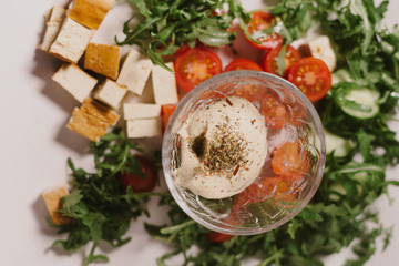 Fototapeta na wymiar Vegetarian healthy dinner cucumber, cherry tomatoes, tofu and hummus