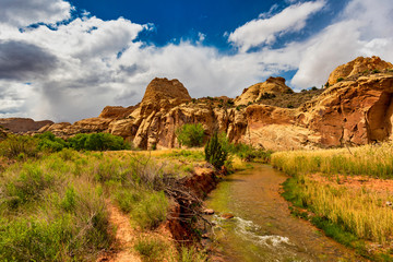 Highway 24 Through Capitol Reef National Park. The main highway that travels through the red rock canyons parallels the Fremont River in the National Park.