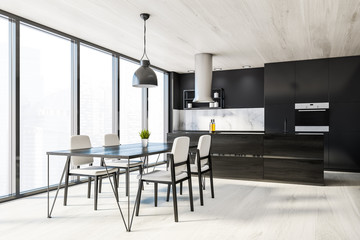 Panoramic black kitchen corner, island and table