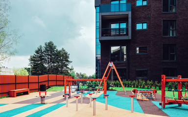Children playground at European modern residential buildings quarter