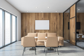 White and wooden office lounge with poster