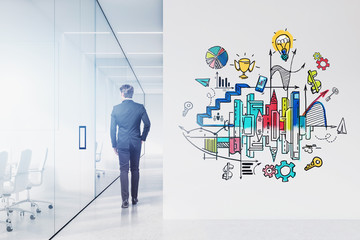 Man in office with business plan sketch