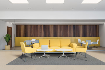 Yellow and dark wood office lounge, yellow sofas