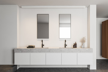 White bathroom interior with double sink