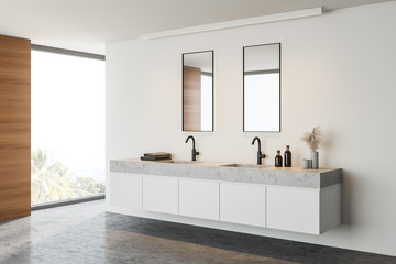 Double sink in white and wooden bathroom