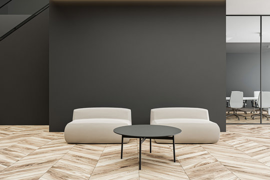 Armchairs in grey office waiting room