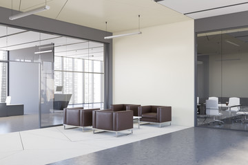White waiting room corner with armchairs