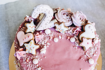 Birthday cake for girls. With cookies and pink airy marshmallows, with pink-violet fruit glaze.