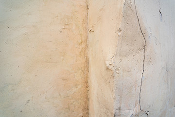 Light wall with crumpled corner and crack