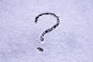 Question mark written with a finger on the snow on the windshield