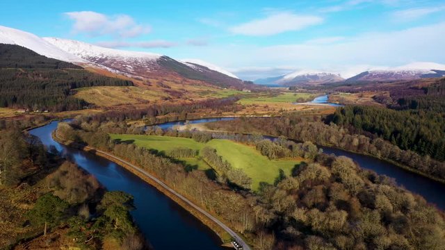 aerial drone footage of the caledonian canal and fort william in the argyll region of the highlands of scotland on a clear blue winter day