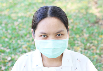 face of asian woman wearing mask.