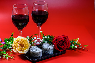 Rose, red wine and heart-shaped dragon fruit